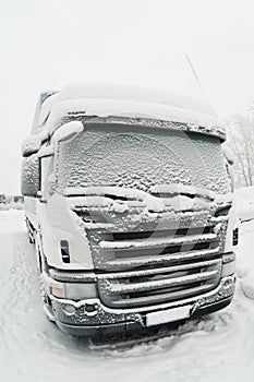 Snow-covered cab of the truck