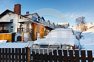 The snow-covered car