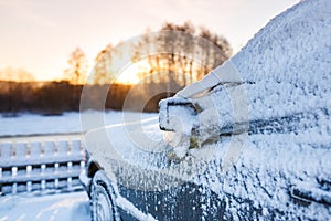 The snow-covered car