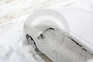 Snow covered car after big snowfall