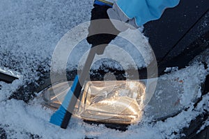 Snow covered car lights