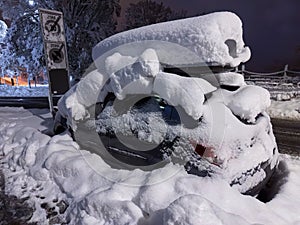 Snow covered car - snowfall in Zurich, Switzerland