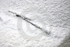 Snow covered car and windshield wiper