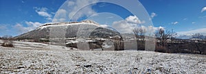 Snow-covered Ceuse mountains and old sheepfold seen from afar