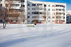 Snow-covered children`s and sports grounds in Russia. Poor cleaning of snow. Inaction of public services