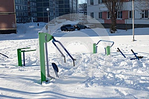 Snow-covered children`s and sports grounds in Russia. Poor cleaning of snow. Inaction of public services