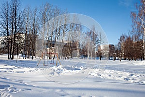 Snow-covered children`s and sports grounds in Russia. Poor cleaning of snow. Inaction of public services.