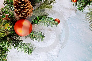 Snow covered christmas decoration with tree branch