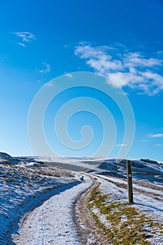 Snow covered Cleeve Hill, Cotwolds, Gloucestershire, UK on a sunny winters day photo