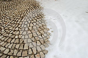 Snow-covered cobblestone floor