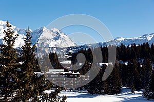 Snow-covered cottages at the French Alps, Les3Vallees. Mountains ski resort. Scenic view of the winter mountains