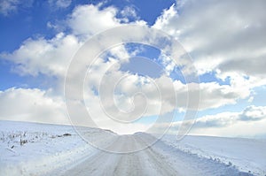 Snow covered country roa