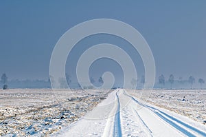 Snow covered countryside road