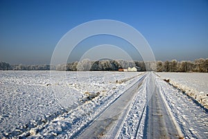 Snow covered countyside road