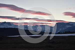 Snow covered Durmitor Mountain sunset with the blushing sky