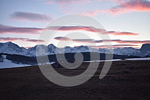 Snow covered Durmitor Mountain sunset with the blushing sky