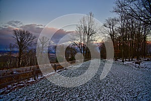 A snow covered evening at rib mountain state park in Wausau Wisconsin at sunset