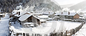 The snow-covered farmhouse