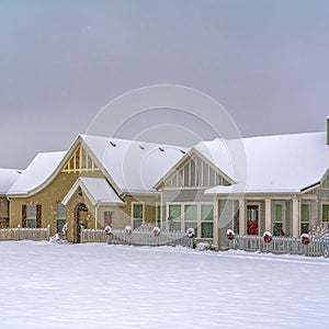 Snow covered festive homes in Daybreak Utah