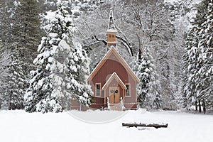 Snow Covered Forest With Wooden Chapel in Yosemite