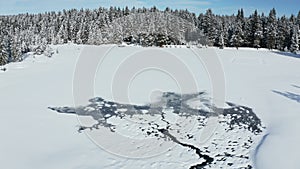 Snow covered frozen lake in winter