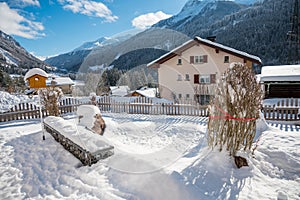 Snow covered garden on a sunny winter morning.