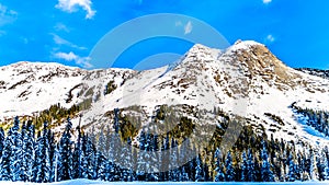The snow covered granite rock face of Yak Peak in the Zopkios Ridge of the Cascade Mountain Range near the Coquihalla Summit photo