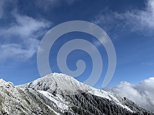 Snow covered Hehuanshan mountain with blue sky stock photo