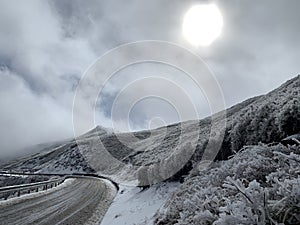 Snow covered Hehuanshan mountain with clouds stock photo