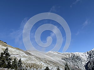 Snow covered Hehuanshan mountain with clouds stock photo