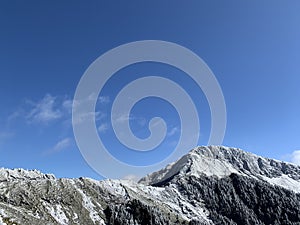 Snow covered Hehuanshan mountain with clouds stock photo