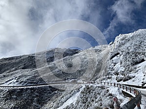 Snow covered Hehuanshan mountain with clouds stock photo