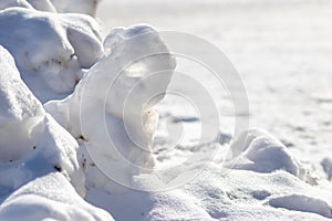 Snow covered landscape in cold winter with frosty and frozen snowbanks show the icy side of winter in January and February as tour