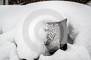 Snow Covered Mailbox. Winter snow caps a mailbox. Snow chaos and catastrophe alert in Bavaria south Germany Winter 2019