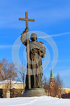 Snow-covered monument to Vladimir the Great on the background of blue sky