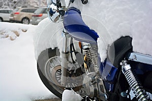 Snow Covered Motorcycle on a Cold Winter Day