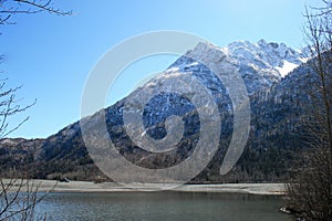 Snow covered mountain along a river