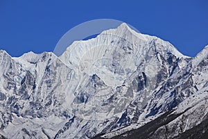 Snow covered mountain Gangchenpo in spring. Langtang valley, Nepal.
