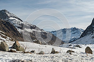 Snow covered mountain panorama on the Julier pass in Switzerland photo