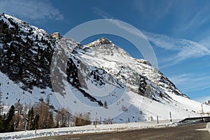 Snow covered mountain panorama on the Julier pass in Switzerland photo