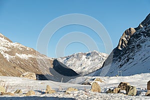 Snow covered mountain panorama on the Julier pass in Switzerland photo