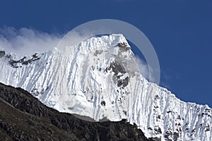 Snow covered mountain peak and blue sky, Cordillera Blanca, Peru