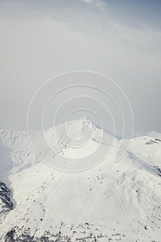 Snow-covered mountain peak in a winter landscape