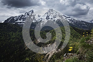Snow covered mountain peaks of Watzmann at Berchtesgaden with dramatic clouds, Bavaria