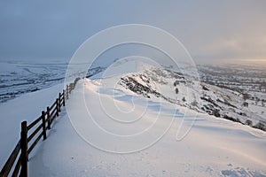 Snow covered mountain at sunrise