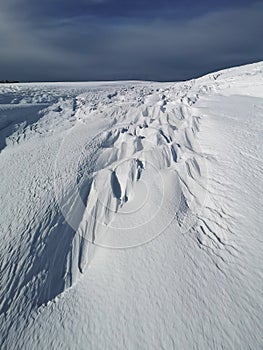 Snow covered mountain - wind snow  shapes in the mountains