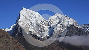 Snow covered mountains Cholatse and Tobuche