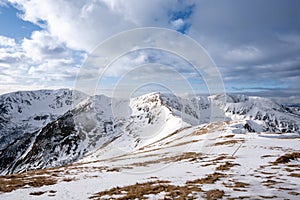 Snow covered mountains with clouds and mist in valley, Low Tatras Dumbier, Slovakia