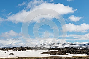 Snow-covered mountains, cloudy, Blue skies