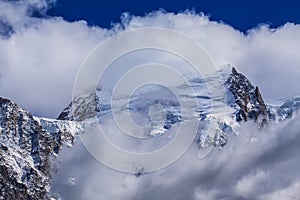 Snow covered mountains and rocky peaks in the French Alps
